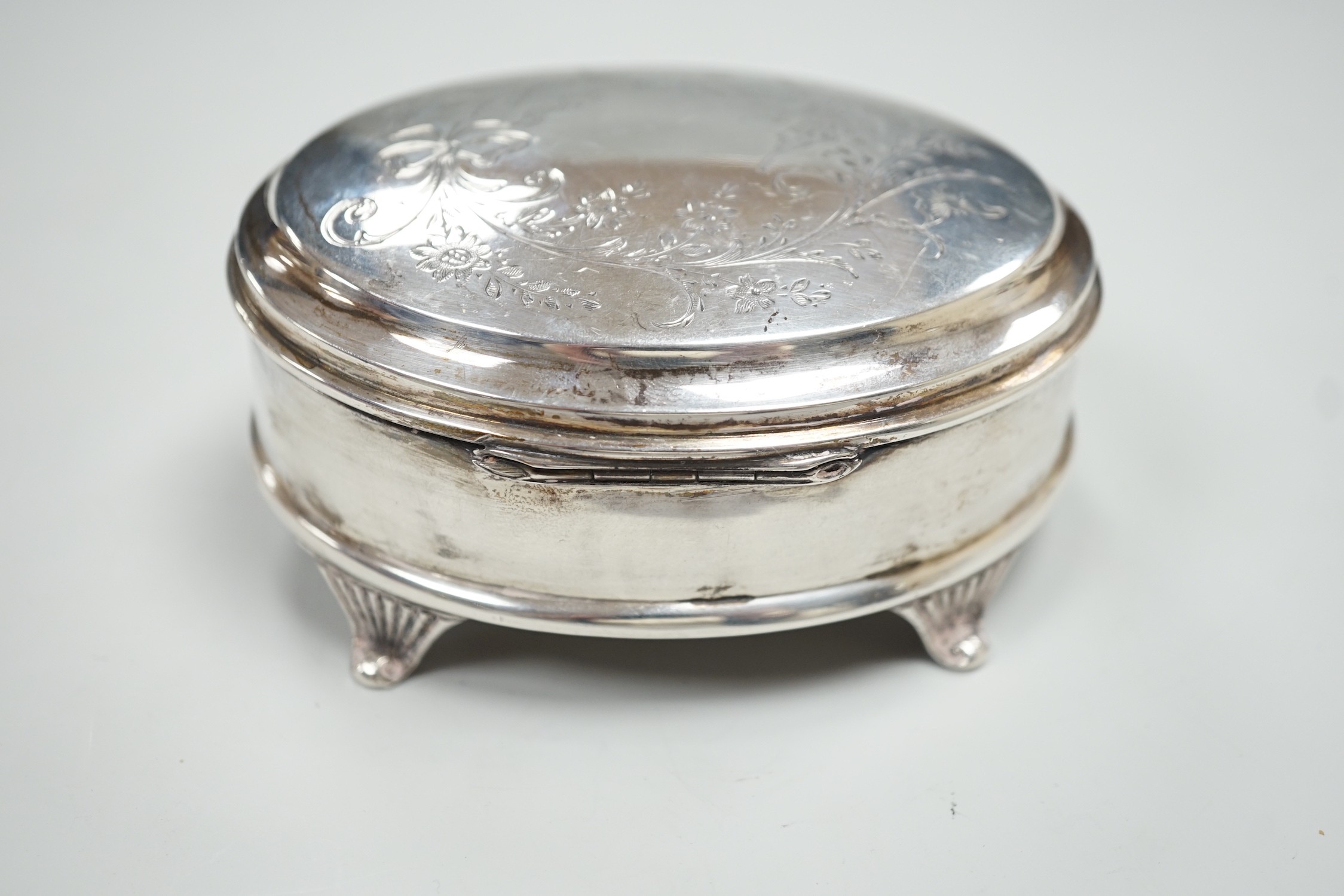 A George V engraved silver mounted oval trinket box, Joseph Gloster Ltd?, Birmingham, 1924, 10.1cm.